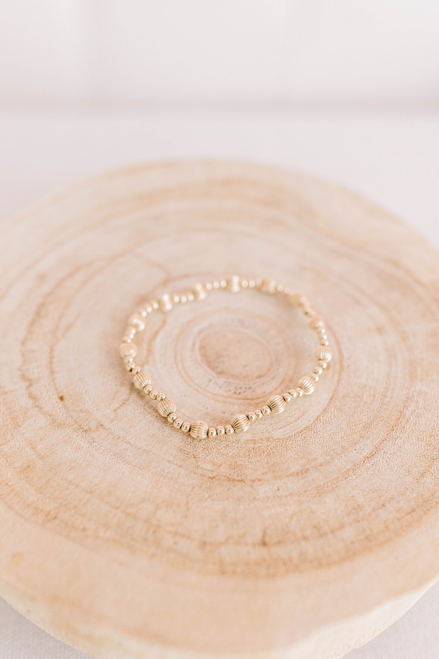 Praise be to the God and Father of our Lord Jesus Christ, the Father of compassion and the God of all comfort. When words fall short, this bracelet says it all. If you, or someone you love, is overwhelmed with grief, pain, or heartbreak, let this bracelet be a constant reminder of the compassion and comfort we have in Jesus. This bracelet is adorned with a pattern of one 5mm corrugated bead followed by three 3mm smooth beads in a continual pattern to symbolize 2 Corinthians 1:3