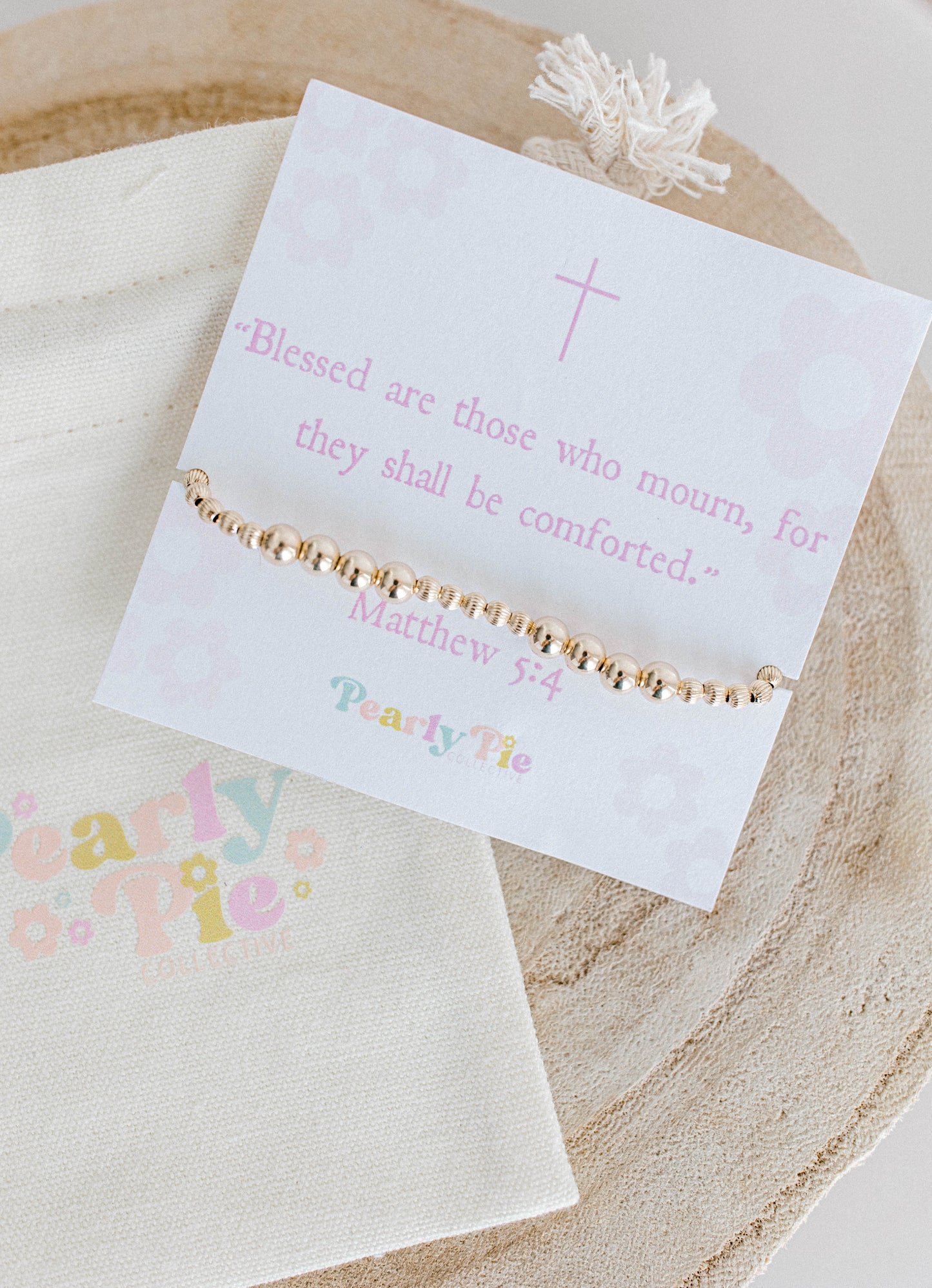 "God blesses those who mourn, for they will be comforted." Matthew 5:4
A bracelet with 14k gold filled or sterling silver beads in a pattern of five 3mm corrugated beads followed by four 5mm beads. A beautiful, simple, dainty piece filled with meaning and lots of comfort for yourself or the people you love. Handmade with lots of love.
