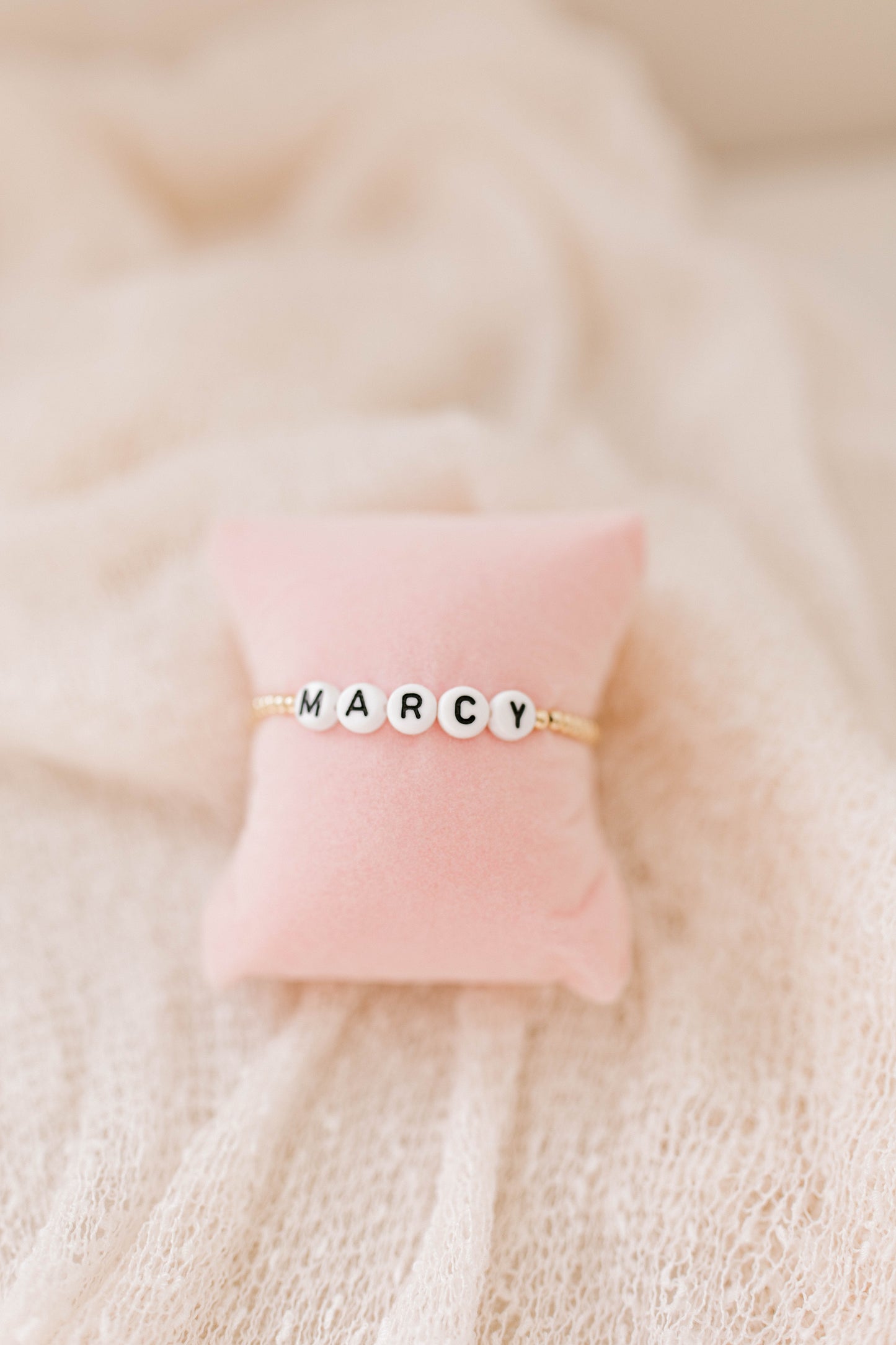 The perfect bracelet for the mini in your life! Matching mama version also available!
* 3mm 14K gold filled or .925 sterling silver beads
* white with black OR white with gold letter beads
Size info:
* Small (Ages 1-4)
* Medium (Ages 4-6)
* Large (Ages 6-10)