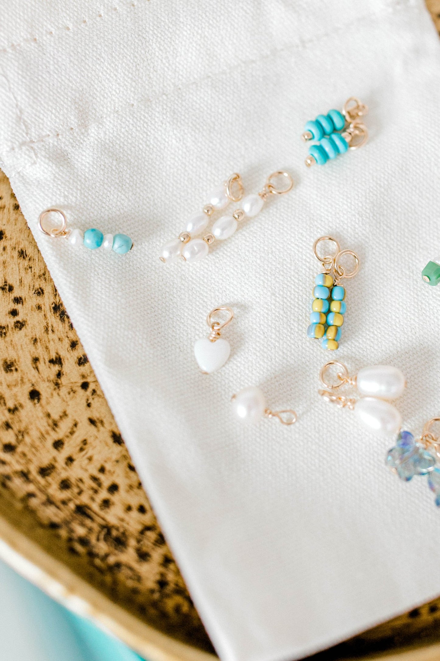 The mother of pearl charm is a small pearl heart charm handmade for your perfectly customized piece.