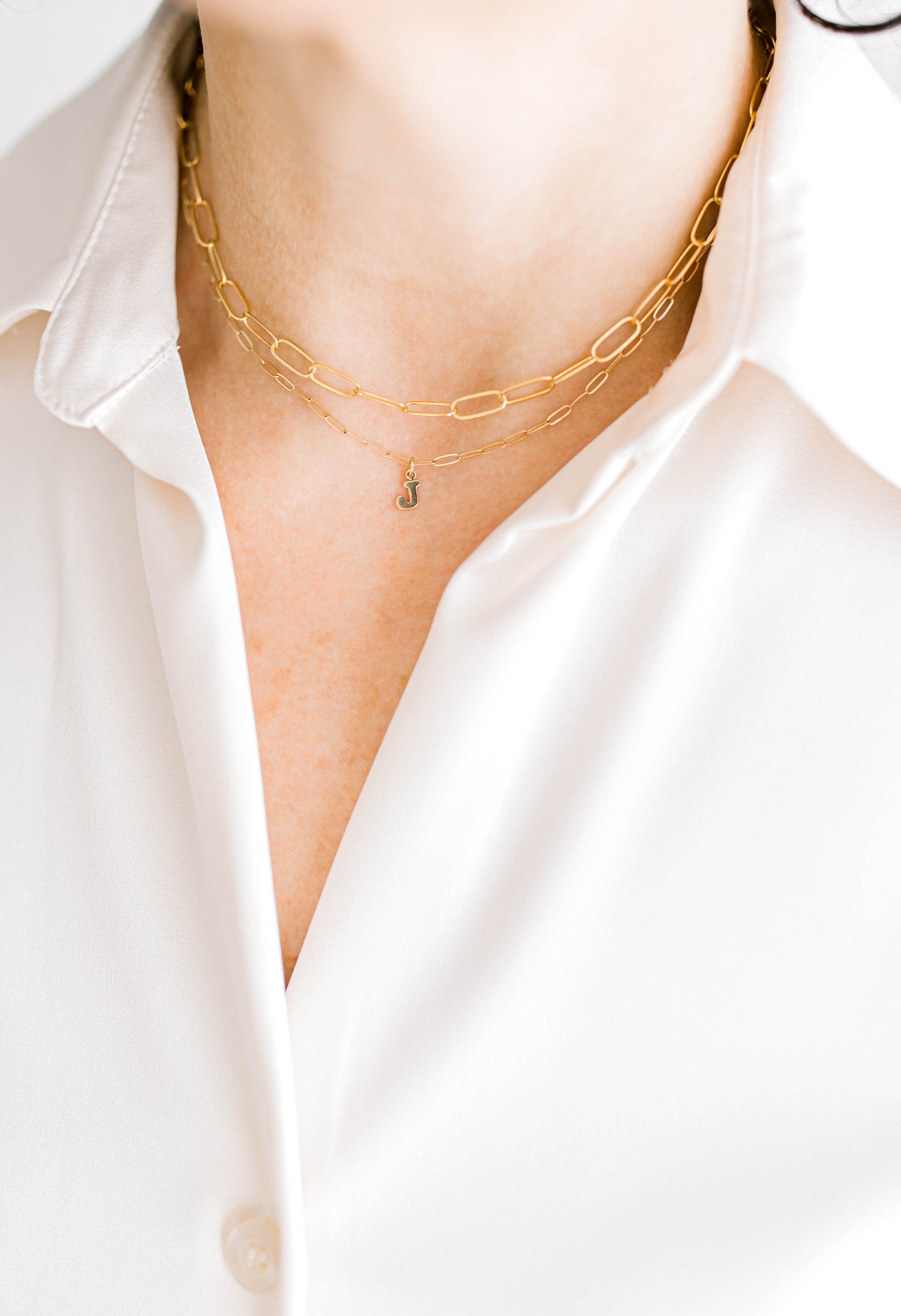 Sweet, simple, and filled with purpose! This necklace is a 14K dainty gold filled paperclip chain with 14K gold filled letter charms and a 14K gold filled lobster clasp. This necklace is 15 inches with an optional 1, 2, or 3 inch extender.
One initial per order. Letters A-Z available. If you'd like more initial tags, please reach out for a custom order!
