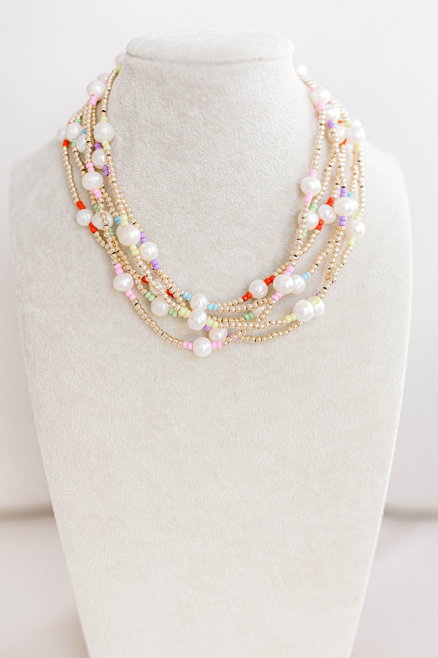 Just like our popular pearly pop bracelets, but in necklace form! The perfect piece for when you need a 'pop" of color! Cute alone or layered with other pearly pops! 15 in with 2 in extender, fresh water pearls, seed beads, gold filled beads, gold filled clasp, and jump rings.