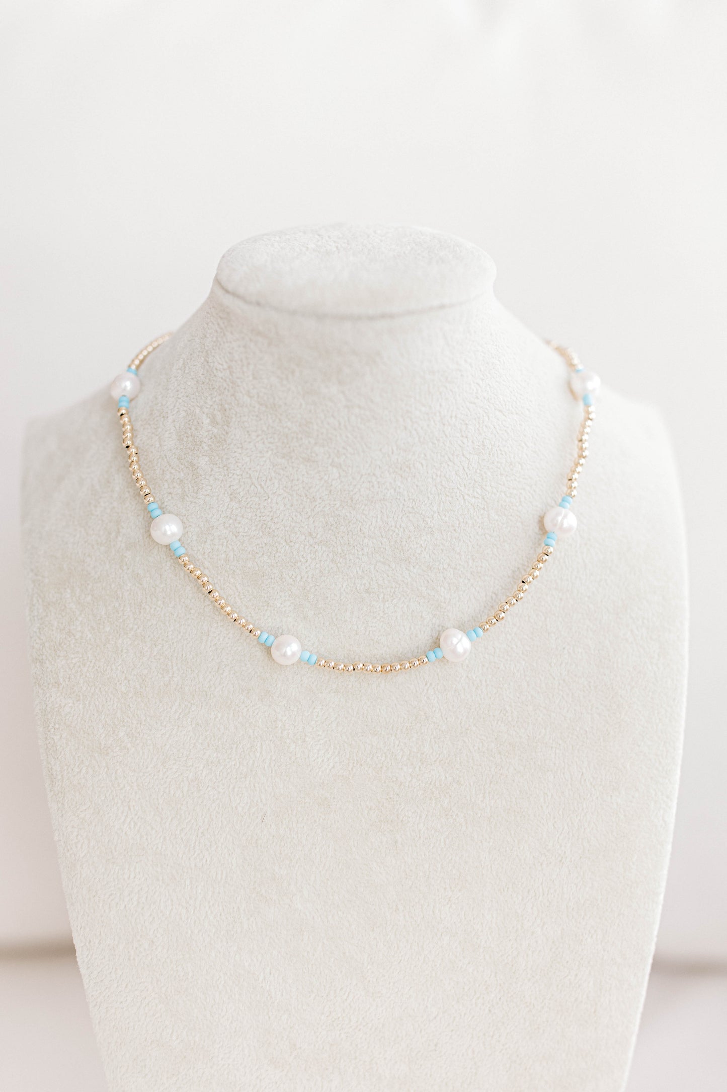 Just like our popular pearly pop bracelets, but in necklace form! The perfect piece for when you need a 'pop" of color! Cute alone or layered with other pearly pops! 15 in with 2 in extender, fresh water pearls, seed beads, gold filled beads, gold filled clasp, and jump rings.