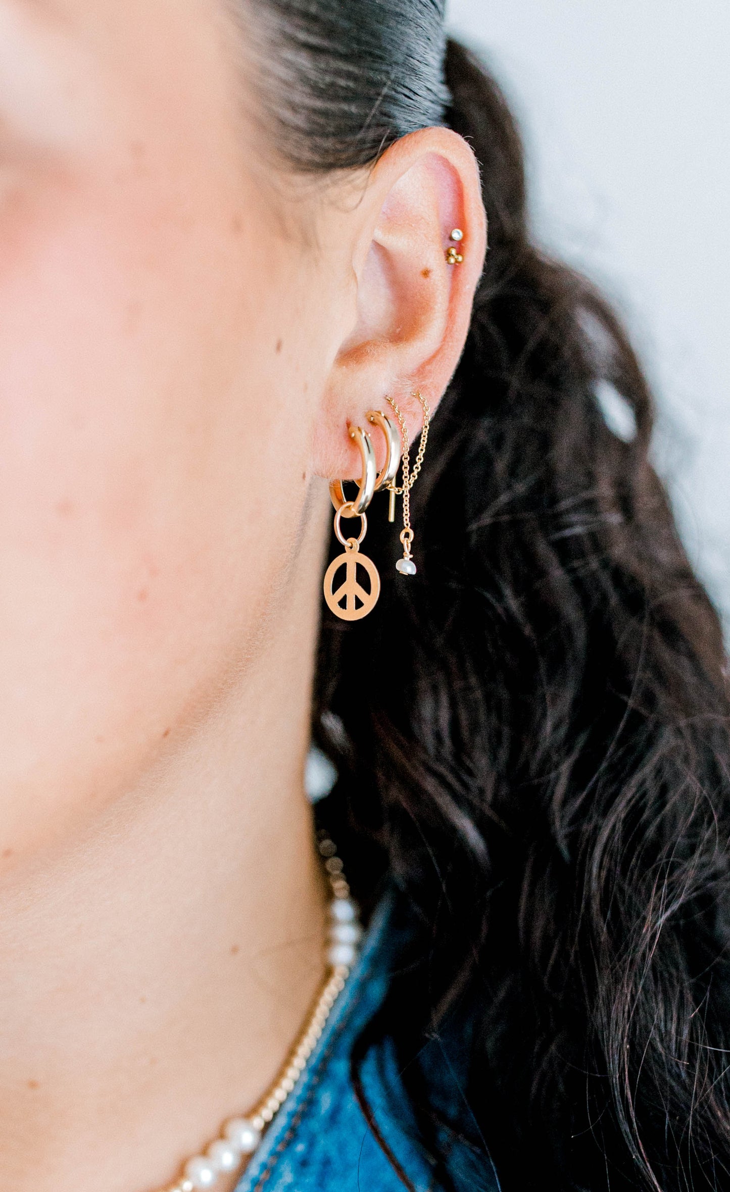 14k gold filled threader earrings that are handmade with a pearl droplet or pearl and turquoise accents at the bottom of this earring. This design has a singular pearl droplet at the bottom. This threader has a very dainty chain that can go through your ears with ease. Can buy singles or pairs of each design.