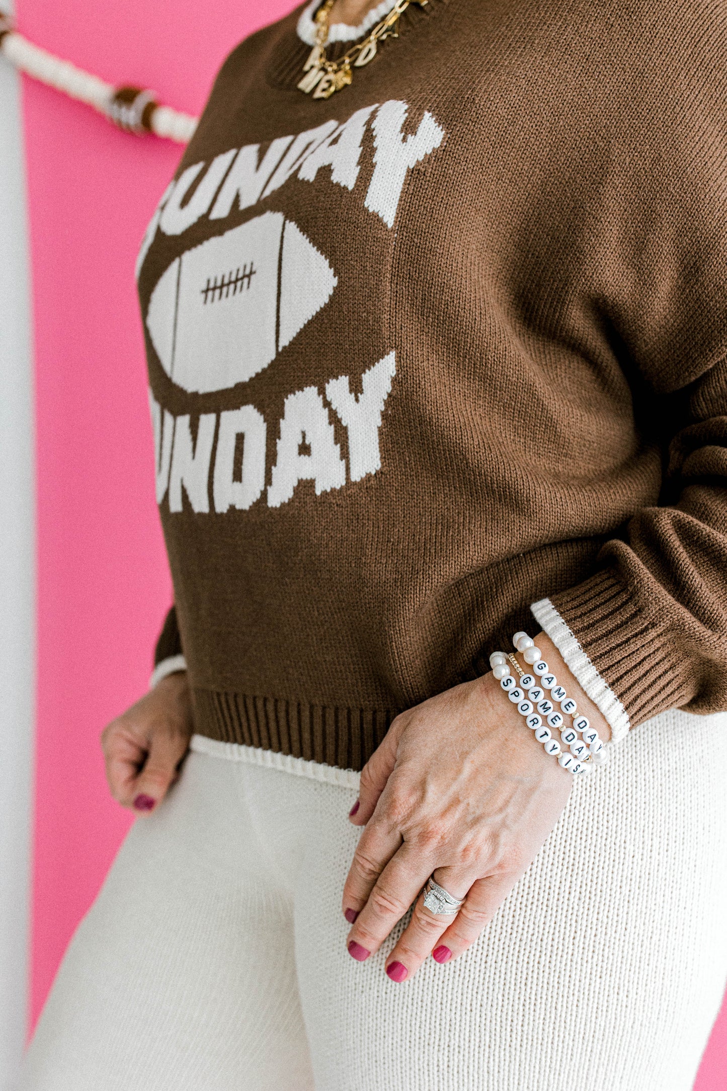 Game day collection items including 14k gold beaded bracelets, pearl beaded bracelets, and custom charm necklaces to celebrate your favorite sports team. Handmade with love using the highest quality materials.