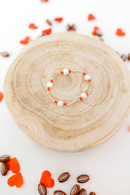 Subtle, dainty, and perfect for all Kansas City Chiefs fans! Our signature Pearly Pop bracelet design, but make it Chiefs!! These bracelets include 3mm 14k gold filled beads, freshwater pearls, and red or yellow seed beads.