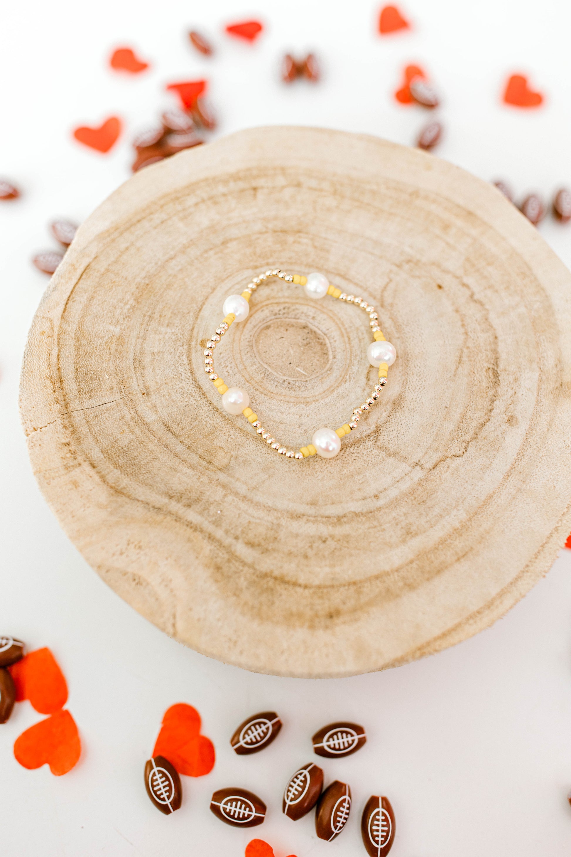 Subtle, dainty, and perfect for all Kansas City Chiefs fans! Our signature Pearly Pop bracelet design, but make it Chiefs!! These bracelets include 3mm 14k gold filled beads, freshwater pearls, and red or yellow seed beads.