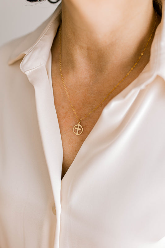 Sweet, simple, and filled with purpose! This necklace is a 14K dainty gold filled chain with a 14K gold filled cross charm and a 14K gold filled lobster clasp. This necklace is 15 inches with an optional 1, 2, or 3 inch extender.