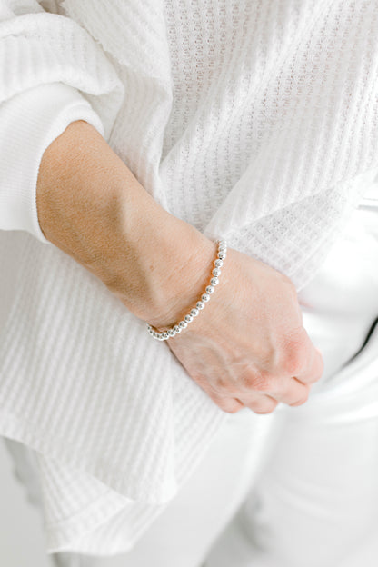 Beautiful, dainty, and perfect for stacking! These bracelets can easily take you from your work out to a night out! Hand strung with love on durable, stretchy elastic with all materials proudly made in the USA.
* 14k gold filled beads or .925 sterling silver
* 3mm, 4mm, 5mm, 6mm, and 7mm options