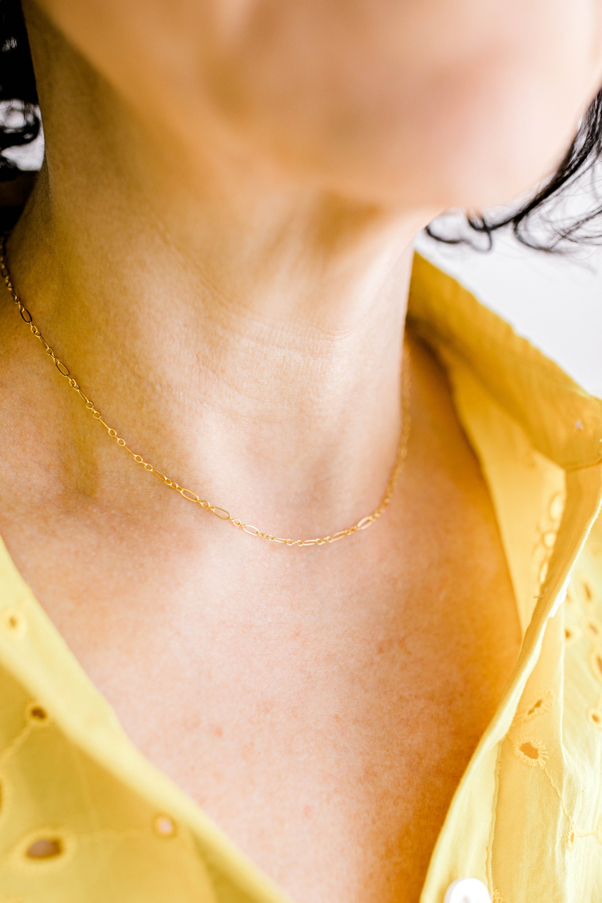 A classic and simple essential chain for everyone's jewelry collection. This is a perfect 14K dainty gold filled chain with a 14K gold filled lobster clasp. 15 inch chain with optional 1, 2, or 3 inch extender.