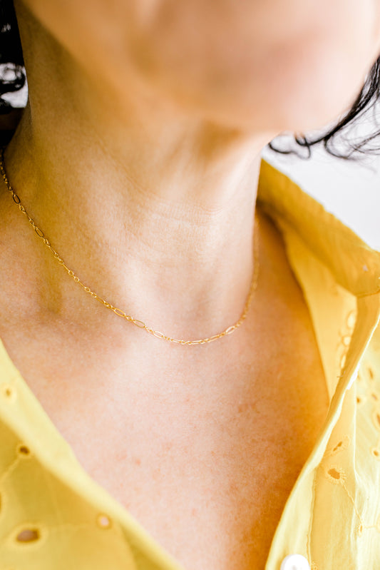 A classic and simple essential chain for everyone's jewelry collection. This is a perfect 14K dainty gold filled chain with a 14K gold filled lobster clasp. 15 inch chain with optional 1, 2, or 3 inch extender.