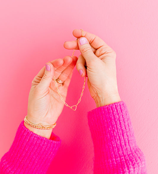 So sweet, subtle, and perfect for a night out or a casual day of errands! This necklace is a 14K dainty gold filled medium link chain with a 14K heart connector charm and a 14K gold filled lobster clasp. This necklace is 15 inches with an optional 1, 2, or 3 inch extender.