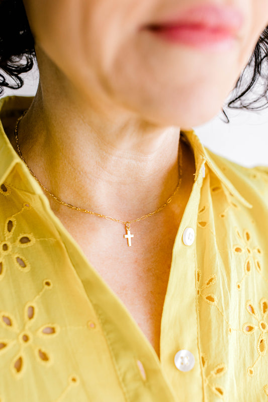 Sweet, simple, and filled with purpose! This necklace is a 14K dainty gold filled chain with a 14K gold filled cross charm and a 14K gold filled lobster clasp. This necklace is 15 inches with an optional 1, 2, or 3 inch extender.