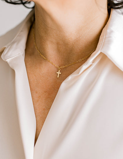 Sweet, simple, and filled with purpose! This necklace is a 14K dainty gold filled chain with a 14K gold filled cross charm and a 14K gold filled lobster clasp. This necklace is 15 inches with an optional 1, 2, or 3 inch extender.