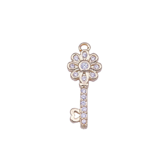 A 14k gold filled flower key charm made perfectly for your custom made Pearly Pie charm necklace.