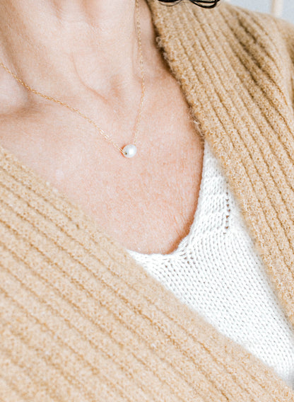 He Left the 99 jewelry collection necklace that is a 14k gold oval chain with a single pearl