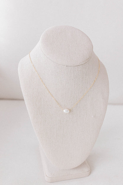 He Left the 99 jewelry collection necklace that is a 14k gold oval chain with a single pearl