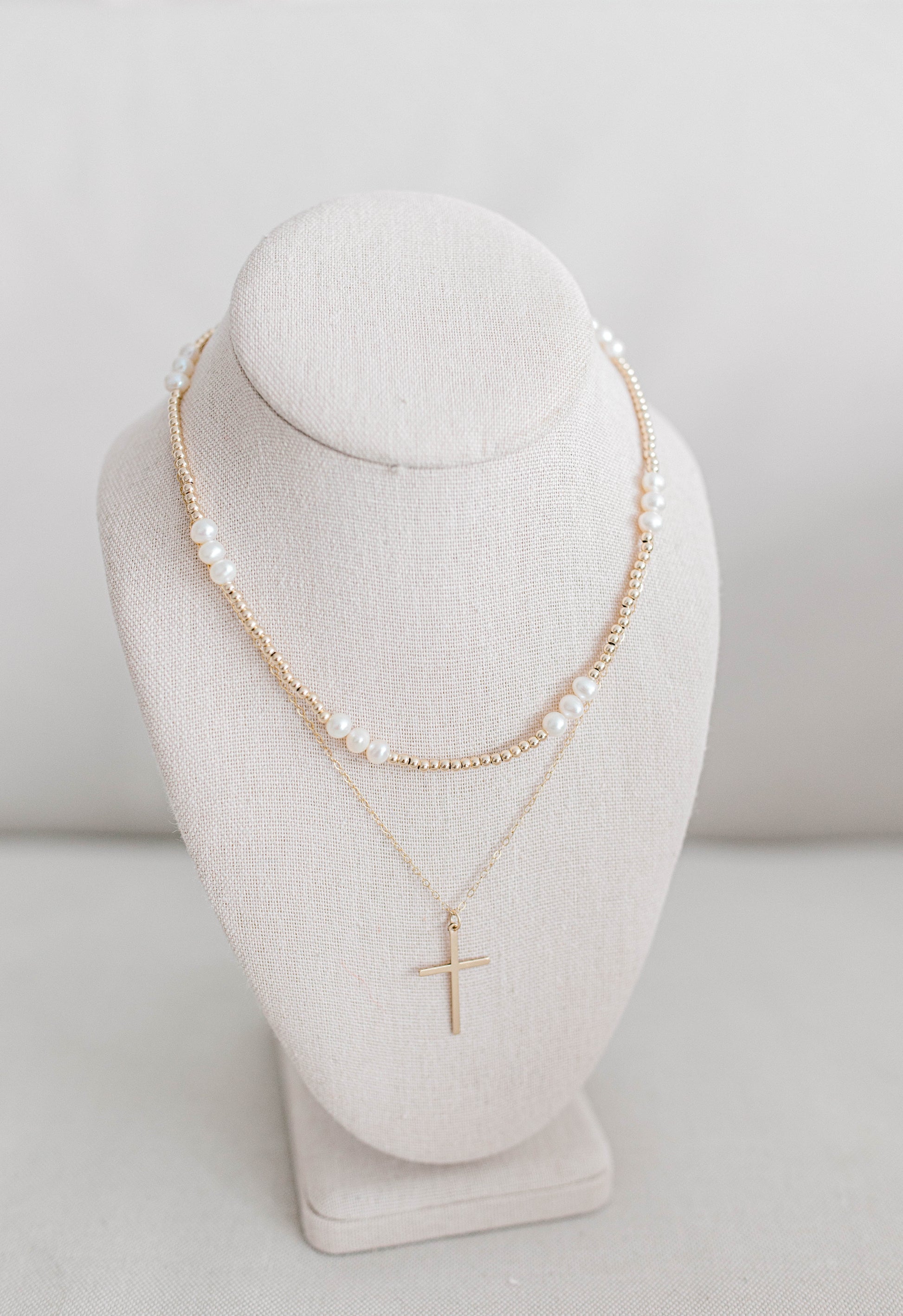 The Large Gold Cross is a 17x28mm gold filled cross on 1.5mm dainty gold filled oval chain with gold filled clasp and findings. 18" in total length.  If an extender is desired please add to notes.

For the John 3:16 necklace we have a pattern of three larger beads followed by sixteen smaller beads. All 14K gold filled beads, fresh water pearl, or .925 sterling silver beads, all materials proudly made in the USA. Available in 15 inch or 17 inch.

*extended sizing available upon request*