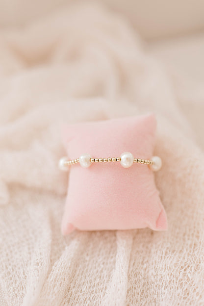 Simple, dainty, and beautiful! The perfect combination for everyday wear or a special occasion. Hand made and strung with love, perfect for you or gifting to someone you love! 3mm 14K gold filled beads with fresh water pearls.
