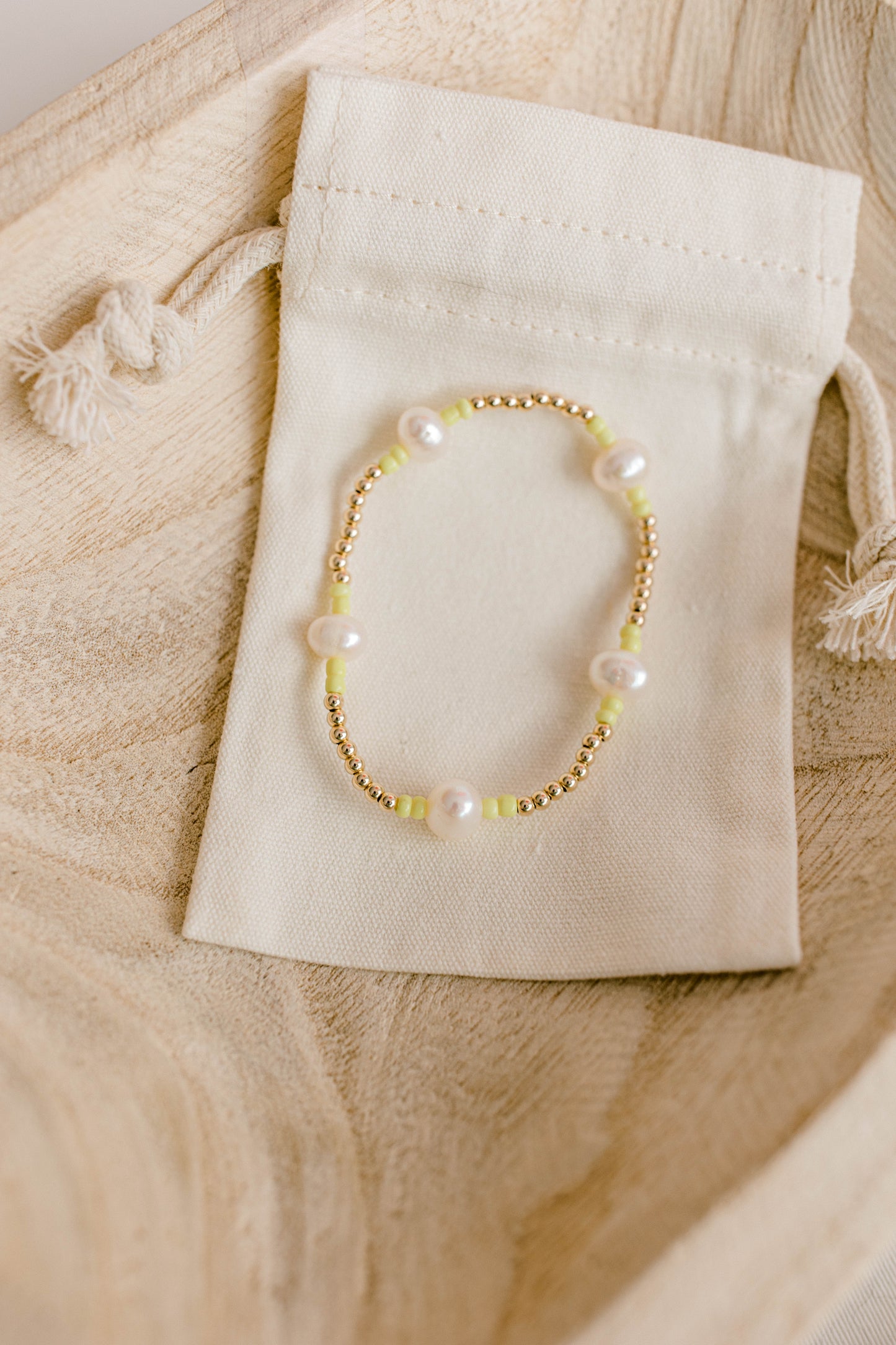 Our signature Pearly Pop bracelet design has our heart! They're fun, simple, and perfect for any occasion! These bracelets include 3mm 14k gold filled beads, freshwater pearls, and colored seed beads of your choosing.