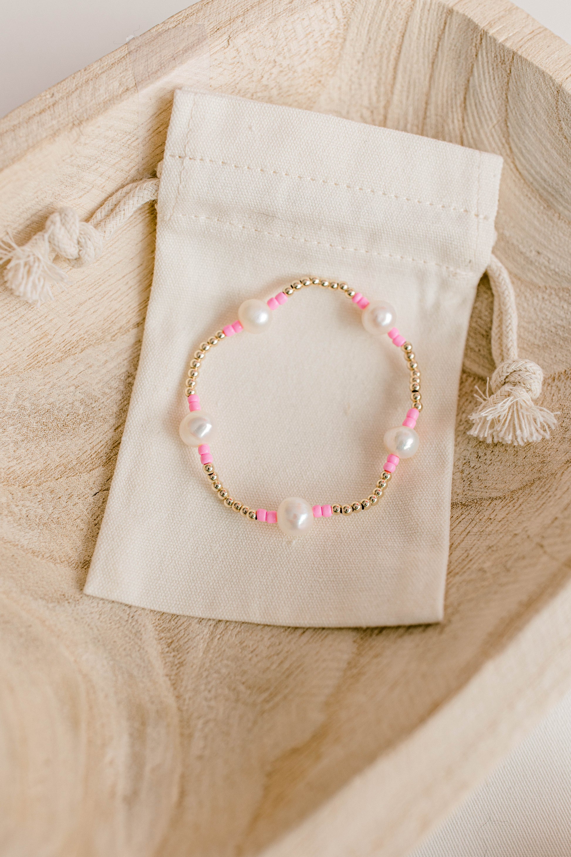 Our signature Pearly Pop bracelet design has our heart! They're fun, simple, and perfect for any occasion! These bracelets include 3mm 14k gold filled beads, freshwater pearls, and colored seed beads of your choosing.