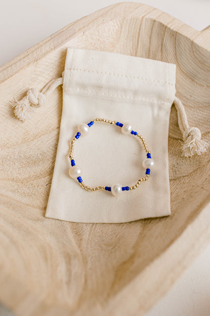 Our signature Pearly Pop bracelet design has our heart! They're fun, simple, and perfect for any occasion! These bracelets include 3mm 14k gold filled beads, freshwater pearls, and colored seed beads of your choosing.