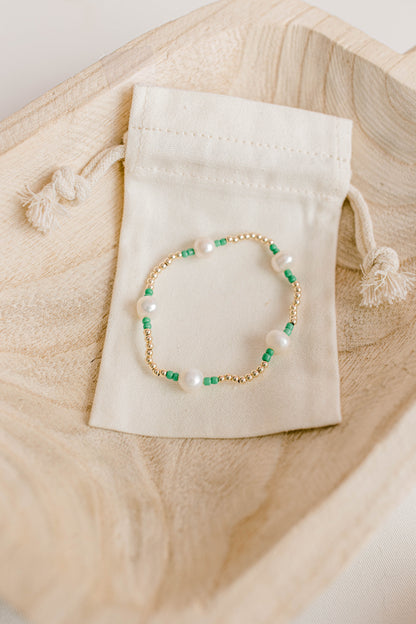 Our signature Pearly Pop bracelet design has our heart! They're fun, simple, and perfect for any occasion! These bracelets include 3mm 14k gold filled beads, freshwater pearls, and colored seed beads of your choosing.