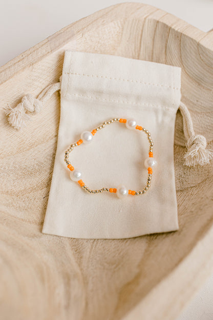 Our signature Pearly Pop bracelet design has our heart! They're fun, simple, and perfect for any occasion! These bracelets include 3mm 14k gold filled beads, freshwater pearls, and colored seed beads of your choosing.