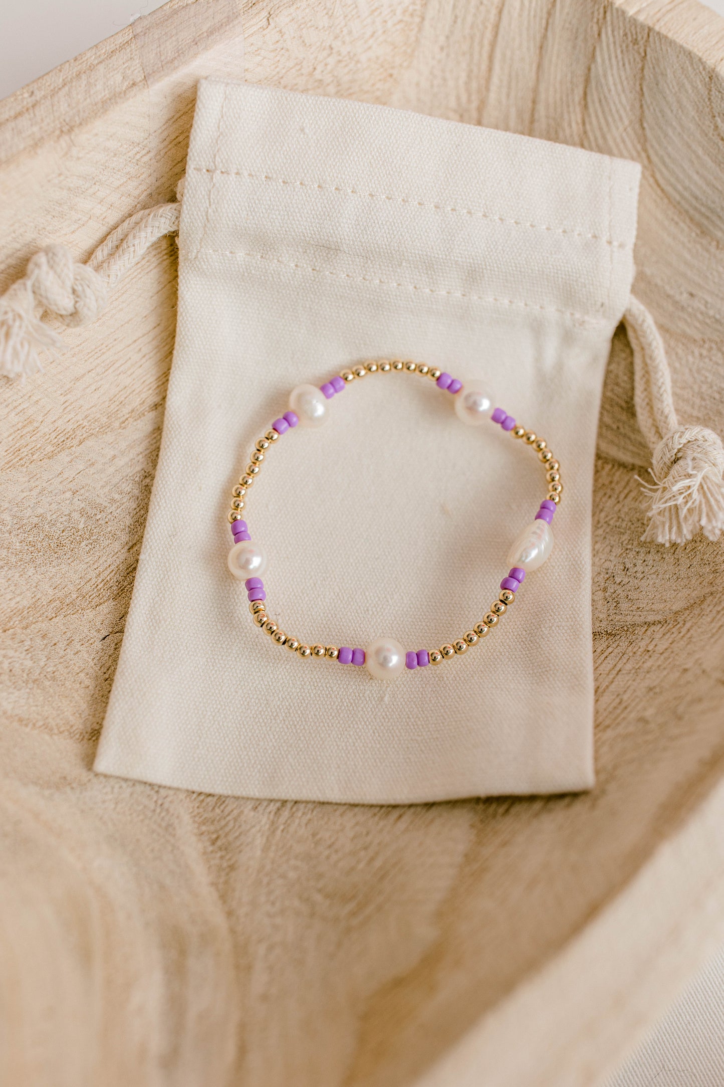 Our signature Pearly Pop bracelet design has our heart! They're fun, simple, and perfect for any occasion! These bracelets include 3mm 14k gold filled beads, freshwater pearls, and colored seed beads of your choosing.