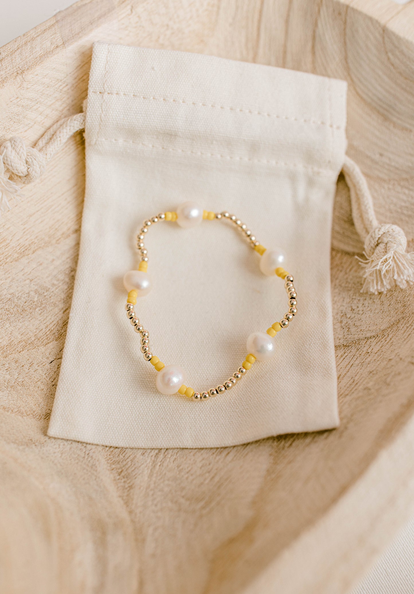 Our signature Pearly Pop bracelet design has our heart! They're fun, simple, and perfect for any occasion! These bracelets include 3mm 14k gold filled beads, freshwater pearls, and colored seed beads of your choosing.