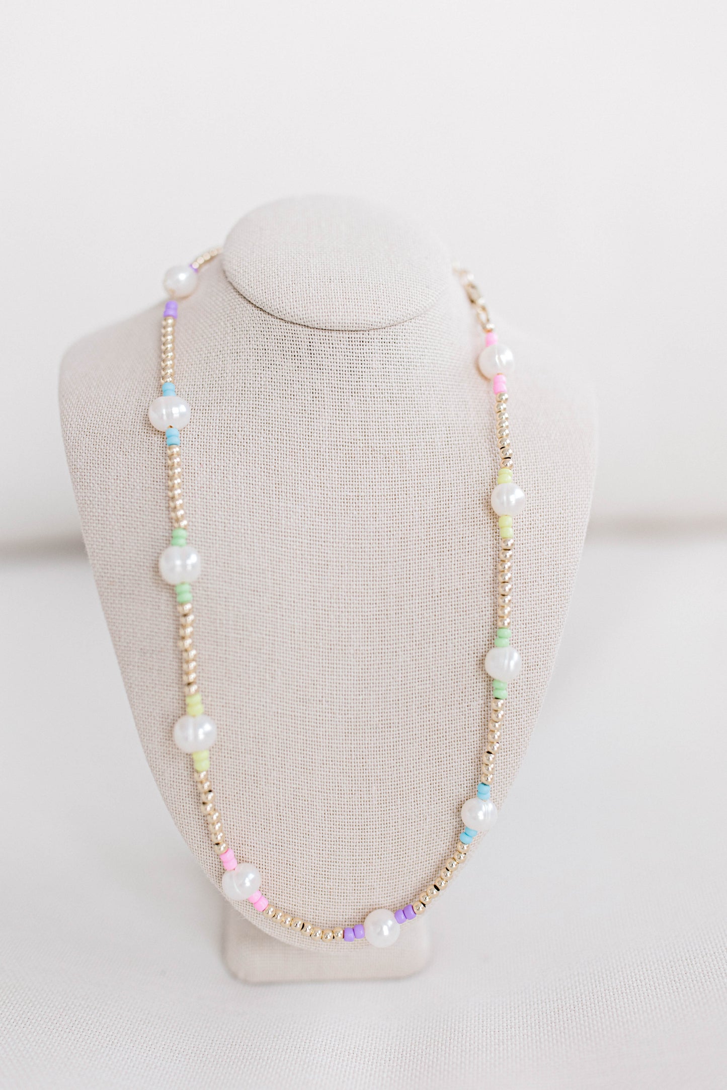 A cute multi-colored pastel seed bead necklace like our classic Pearly Pop necklaces and bracelets. This necklace is 15. in with 2 in. extender, fresh water pearls, seed beads, gold filled beads, gold filled clasp, and jump rings.