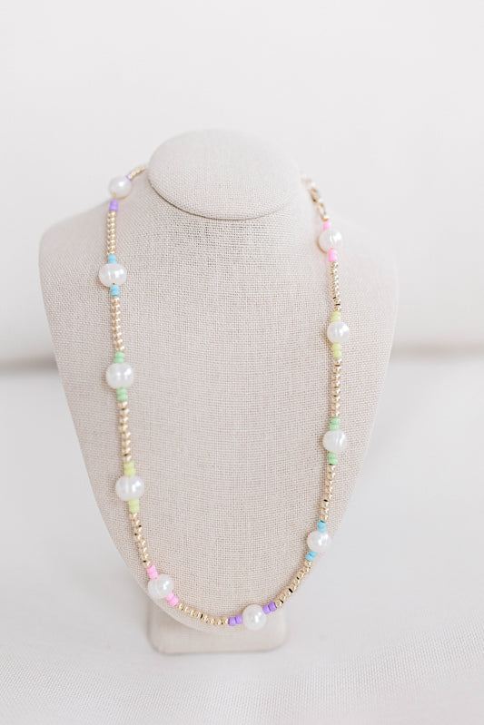 A cute multi-colored pastel seed bead necklace like our classic Pearly Pop necklaces and bracelets. This necklace is 15. in with 2 in. extender, fresh water pearls, seed beads, gold filled beads, gold filled clasp, and jump rings.