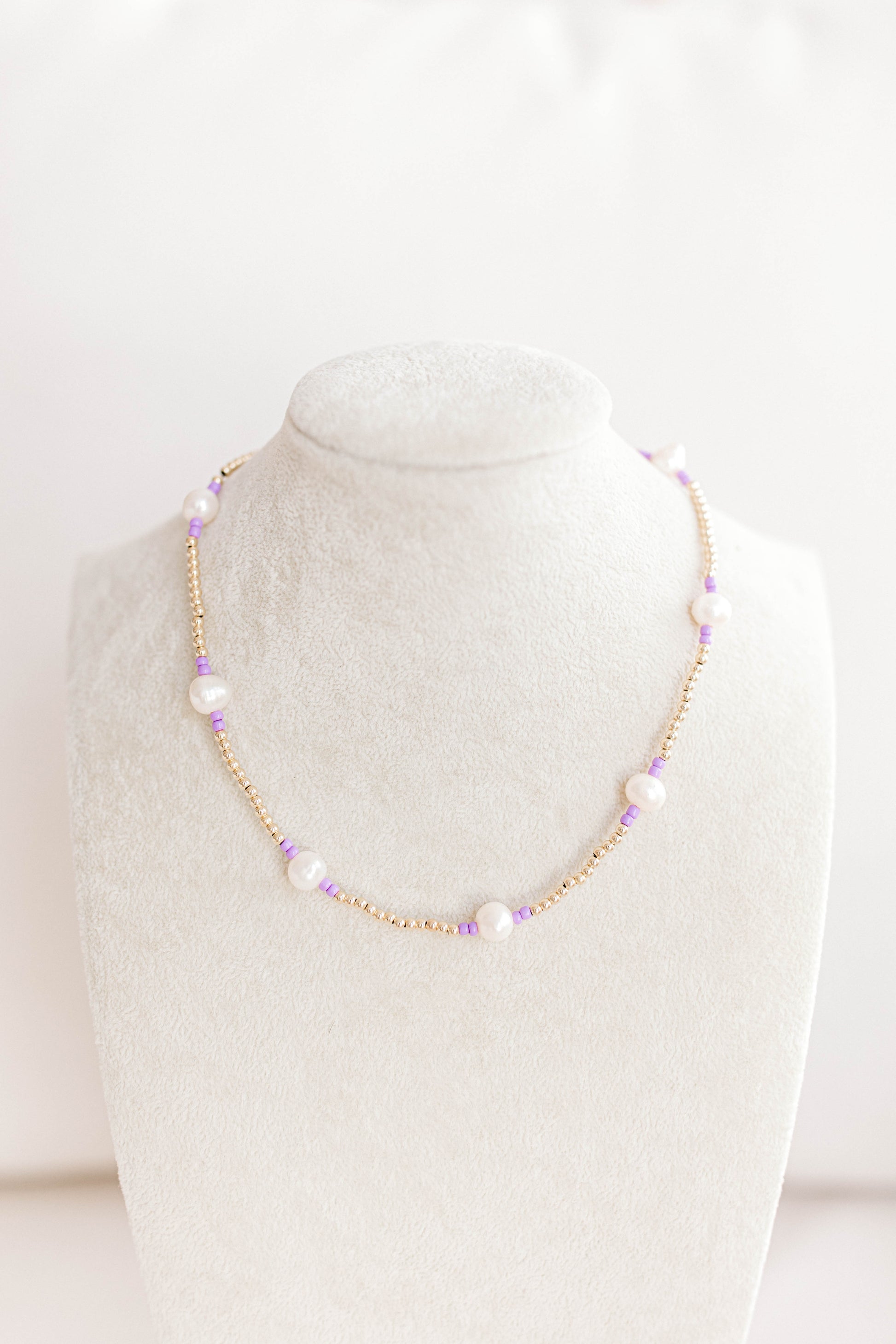 Just like our popular pearly pop bracelets, but in necklace form! The perfect piece for when you need a 'pop" of color!  Cute alone or layered with other pearly pops! 15 in with 2 in extender, fresh water pearls, seed beads, gold filled beads, gold filled clasp, and jump rings.