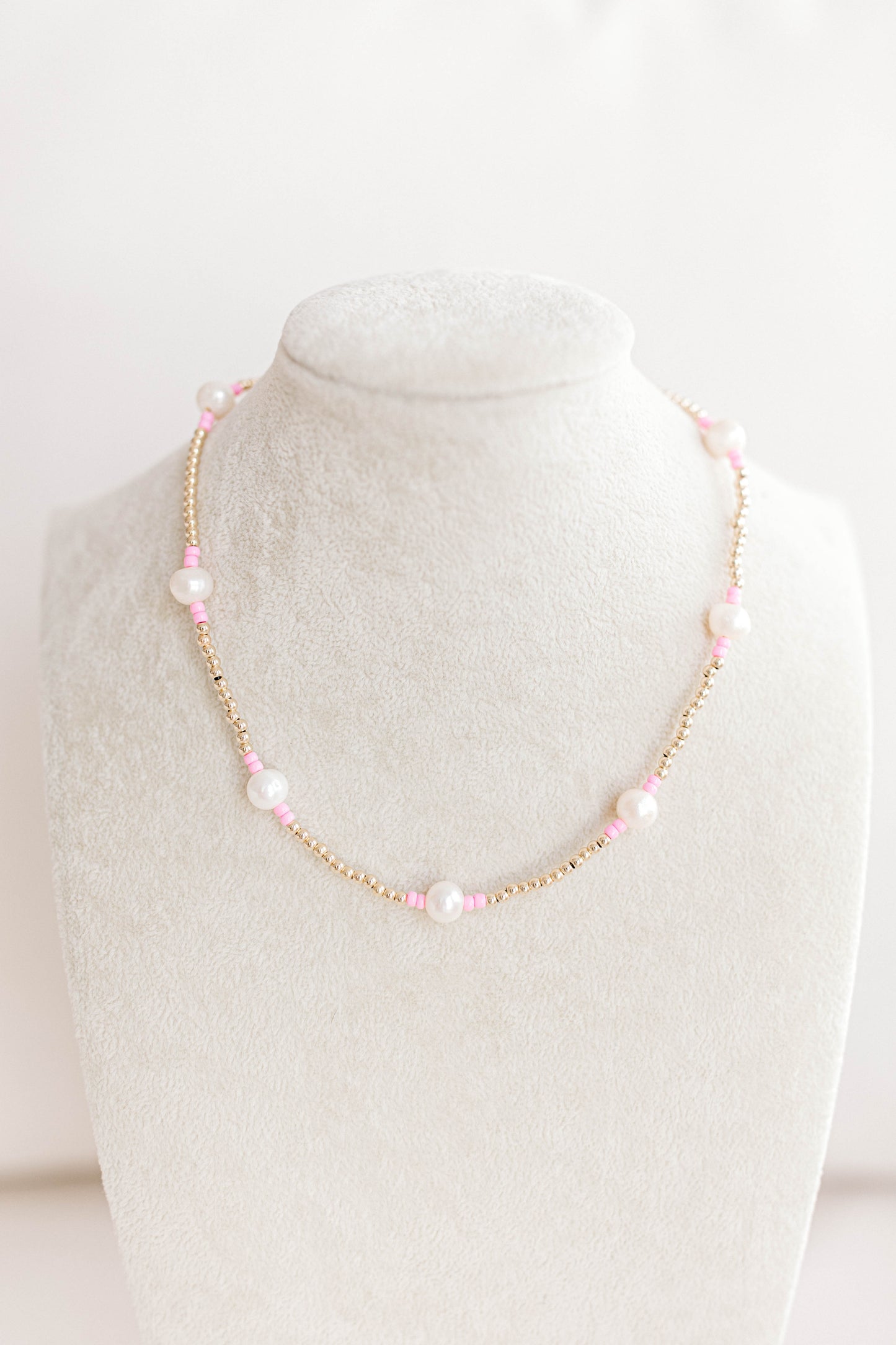 Just like our popular pearly pop bracelets, but in necklace form! The perfect piece for when you need a 'pop" of color!  Cute alone or layered with other pearly pops! 15 in with 2 in extender, fresh water pearls, seed beads, gold filled beads, gold filled clasp, and jump rings.