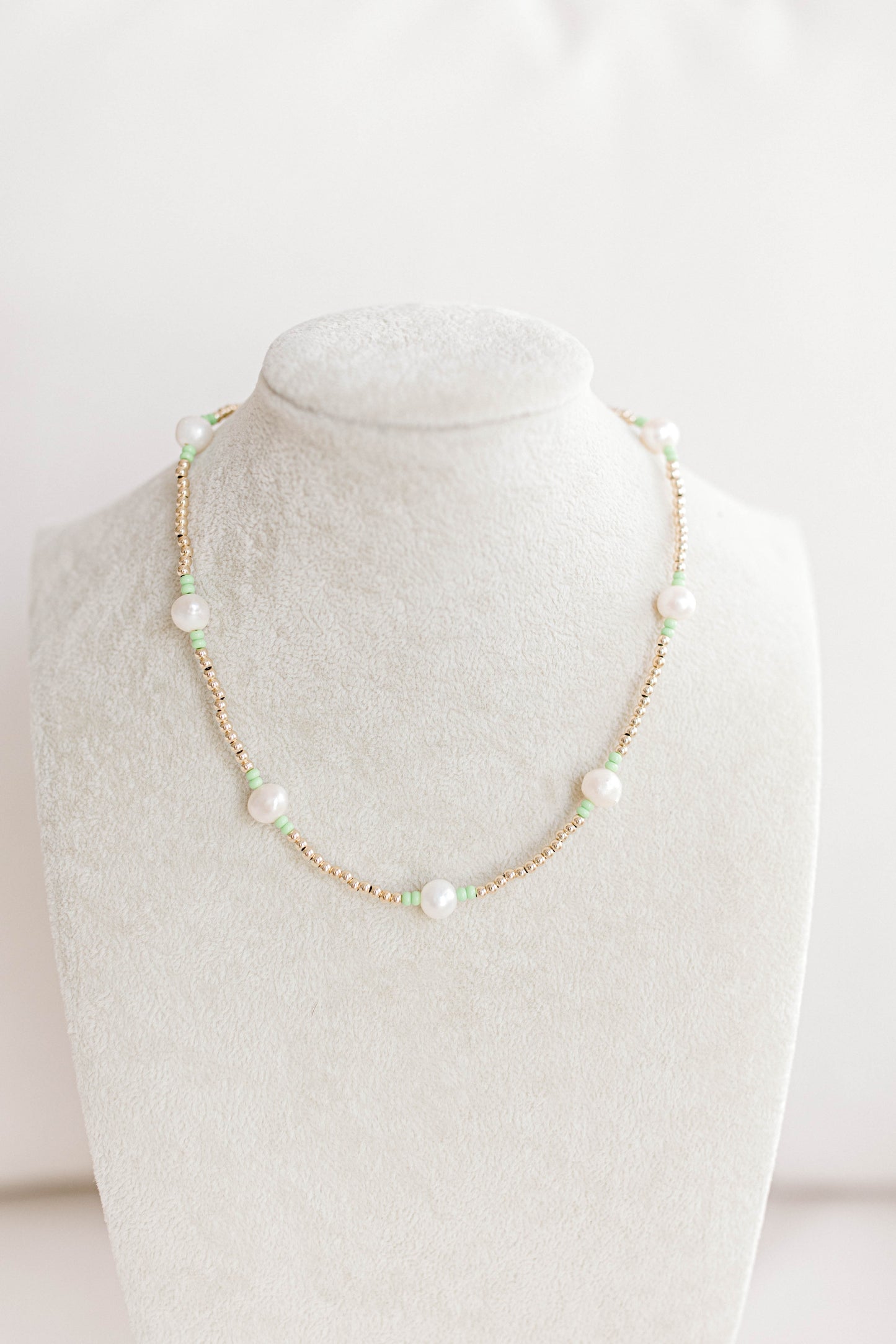 Just like our popular pearly pop bracelets, but in necklace form! The perfect piece for when you need a 'pop" of color!  Cute alone or layered with other pearly pops! 15 in with 2 in extender, fresh water pearls, seed beads, gold filled beads, gold filled clasp, and jump rings.