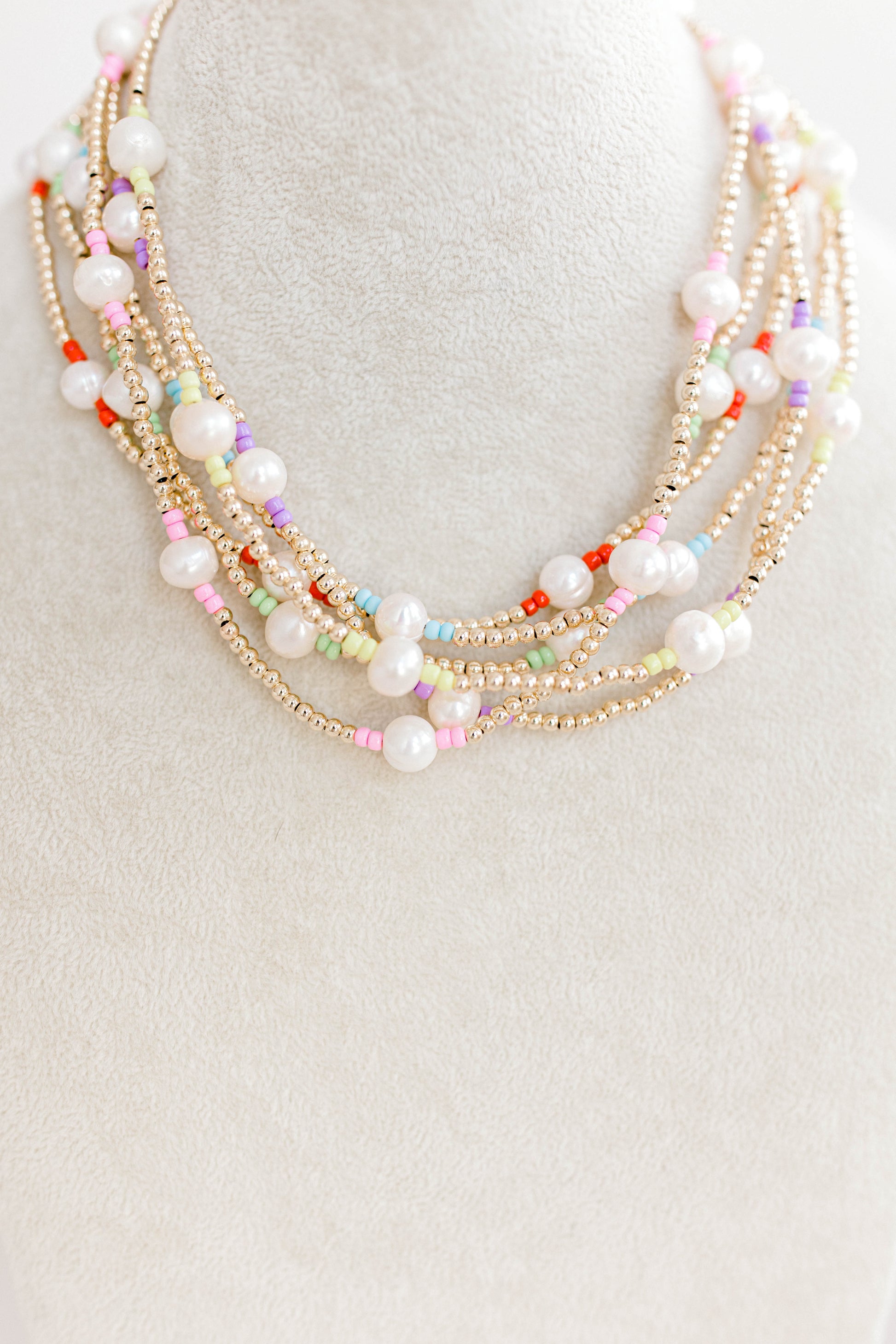 Just like our popular pearly pop bracelets, but in necklace form! The perfect piece for when you need a 'pop" of color!  Cute alone or layered with other pearly pops! 15 in with 2 in extender, fresh water pearls, seed beads, gold filled beads, gold filled clasp, and jump rings.