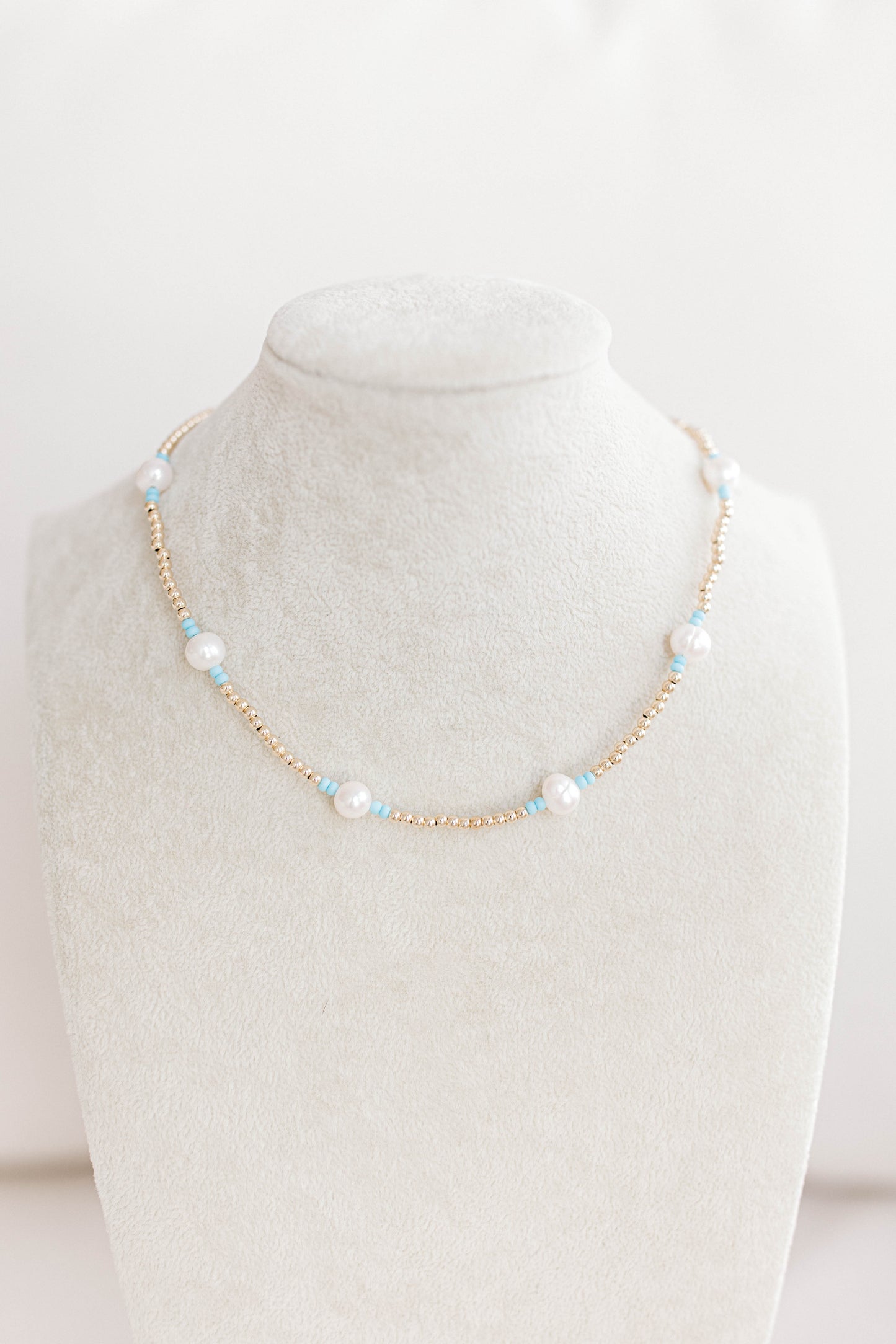 Just like our popular pearly pop bracelets, but in necklace form! The perfect piece for when you need a 'pop" of color!  Cute alone or layered with other pearly pops! 15 in with 2 in extender, fresh water pearls, seed beads, gold filled beads, gold filled clasp, and jump rings.