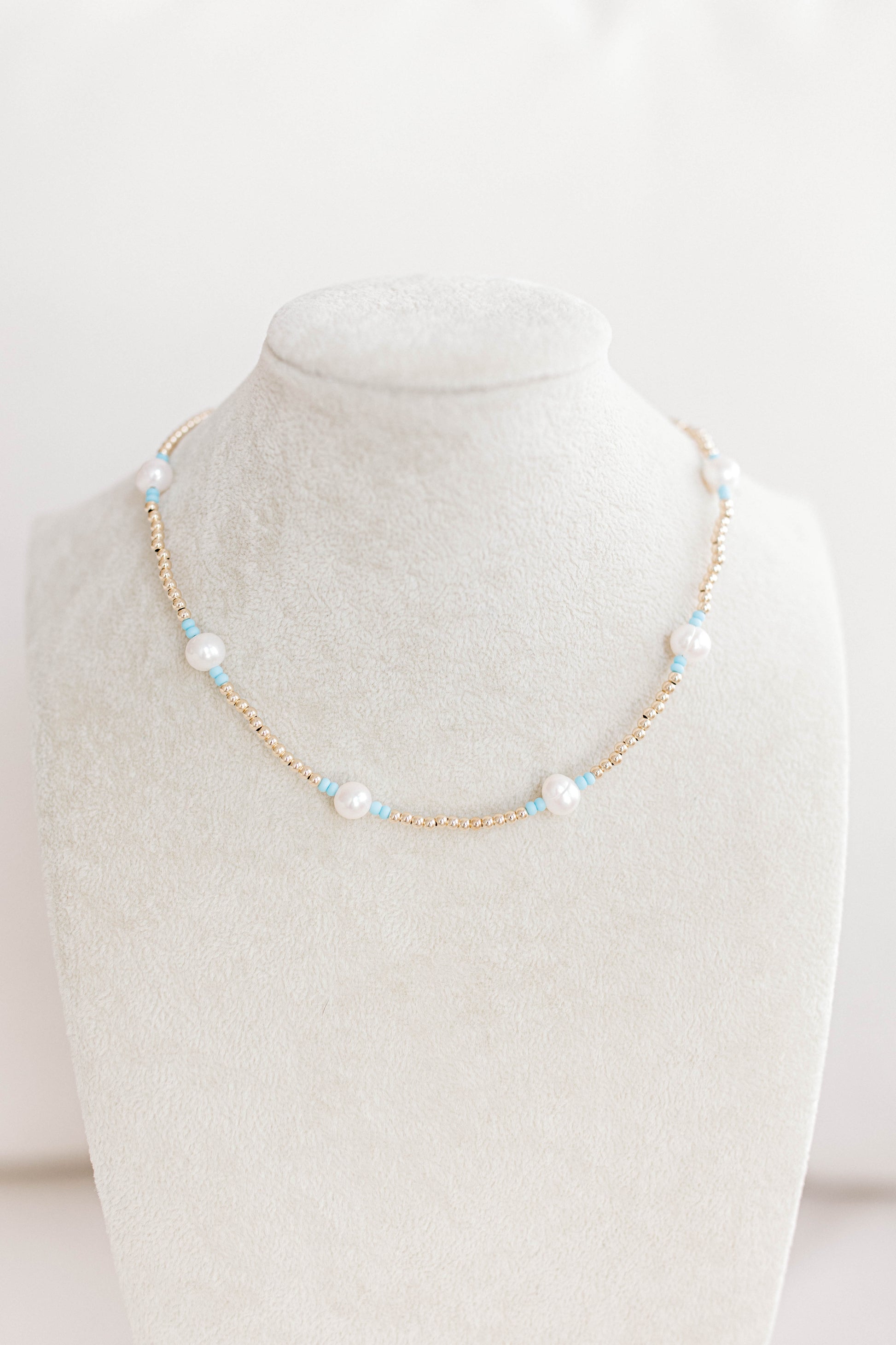 Just like our popular pearly pop bracelets, but in necklace form! The perfect piece for when you need a 'pop" of color!  Cute alone or layered with other pearly pops! 15 in with 2 in extender, fresh water pearls, seed beads, gold filled beads, gold filled clasp, and jump rings.