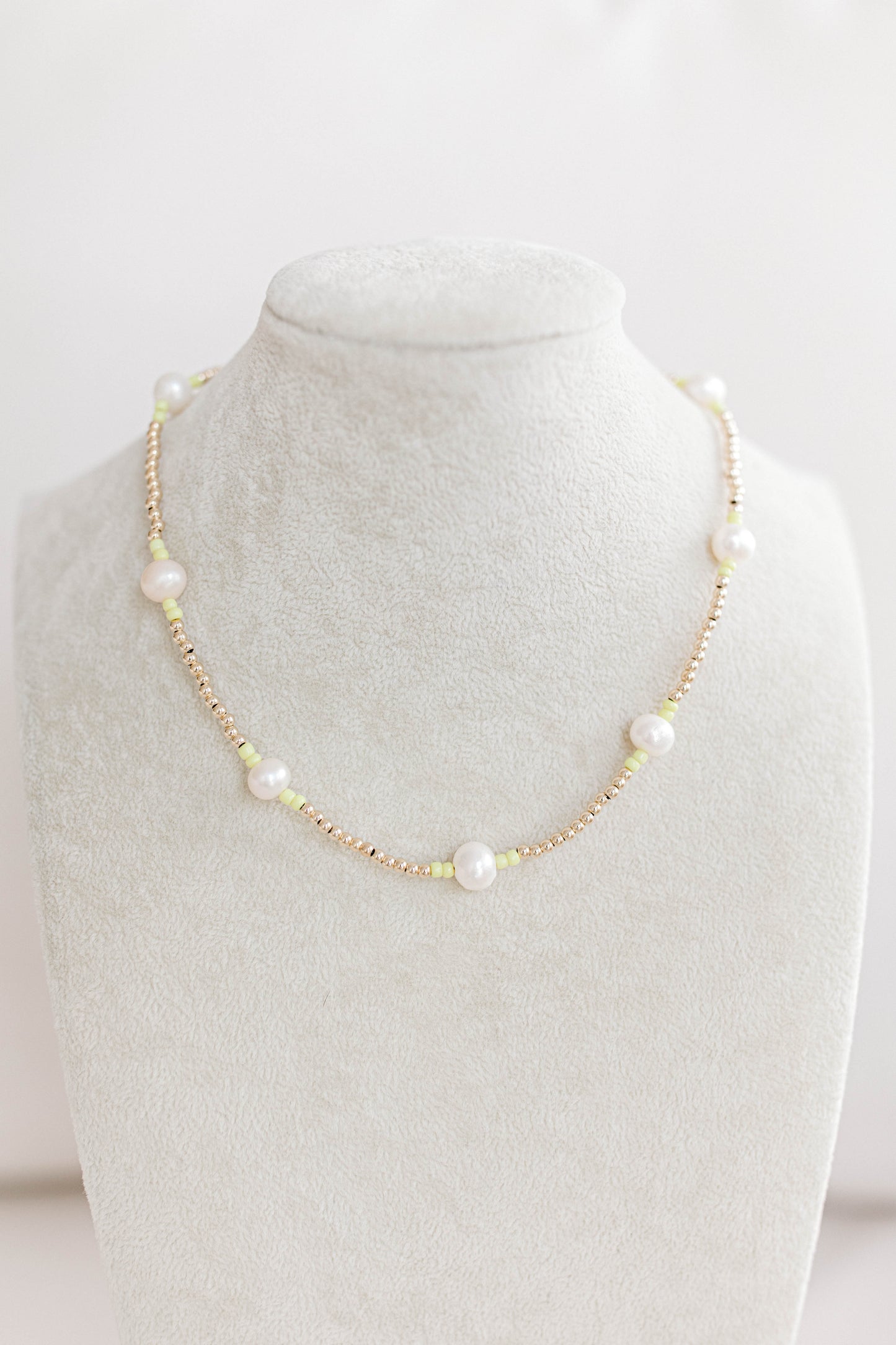 Just like our popular pearly pop bracelets, but in necklace form! The perfect piece for when you need a 'pop" of color!  Cute alone or layered with other pearly pops! 15 in with 2 in extender, fresh water pearls, seed beads, gold filled beads, gold filled clasp, and jump rings.