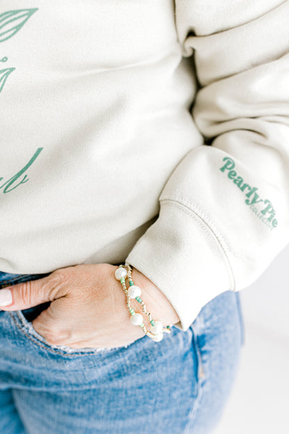 You're in luck - our signature Pearly Pop bracelet design is now available in green to celebrate all things St. Patrick's Day!! They're fun, simple, and perfect for any occasion! These bracelets include 3mm 14k gold filled beads, freshwater pearls, and colored seed beads of your choosing.