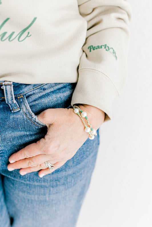 You're in luck - our signature Pearly Pop bracelet design is now available in green to celebrate all things St. Patrick's Day!! They're fun, simple, and perfect for any occasion! These bracelets include 3mm 14k gold filled beads, freshwater pearls, and colored seed beads of your choosing.