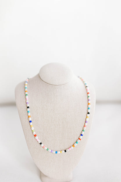 Rainbow necklace but make it grown up! The gorgeous older sister to your childhood rainbow jewelry. This necklace is 15in with a 2in extender using freshwater pearls and alternating colored seed beads. Perfect for bright, sunny, colorful, summer days!