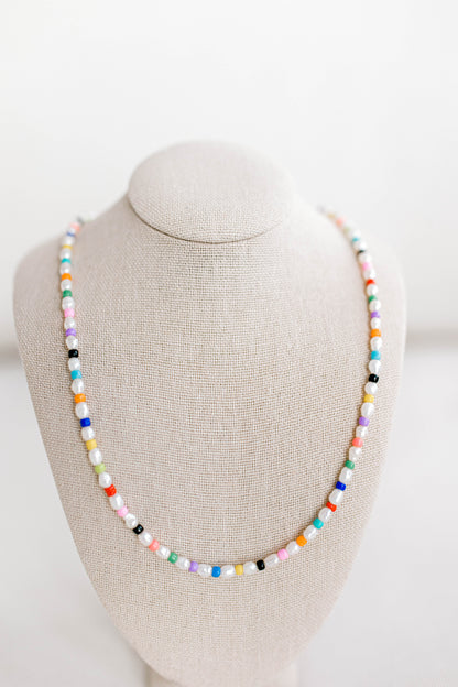 Rainbow necklace but make it grown up! The gorgeous older sister to your childhood rainbow jewelry. This necklace is 15in with a 2in extender using freshwater pearls and alternating colored seed beads. Perfect for bright, sunny, colorful, summer days!