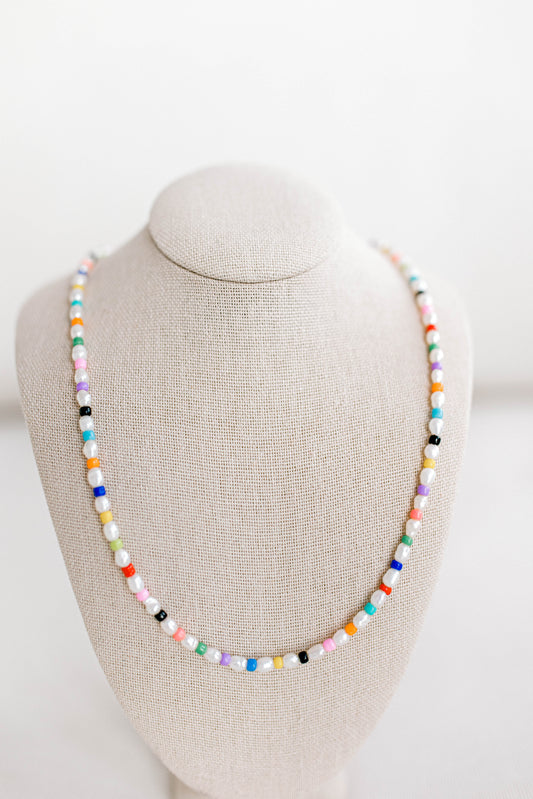 Rainbow necklace but make it grown up! The gorgeous older sister to your childhood rainbow jewelry. This necklace is 15in with a 2in extender using freshwater pearls and alternating colored seed beads. Perfect for bright, sunny, colorful, summer days!