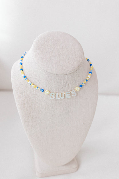 Custom seed bead necklaces with mother of pearl letters supporting your favorite sports team. All colors and letters available.