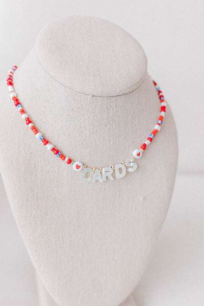 Custom seed bead necklaces with mother of pearl letters supporting your favorite sports team. All colors and letters available.