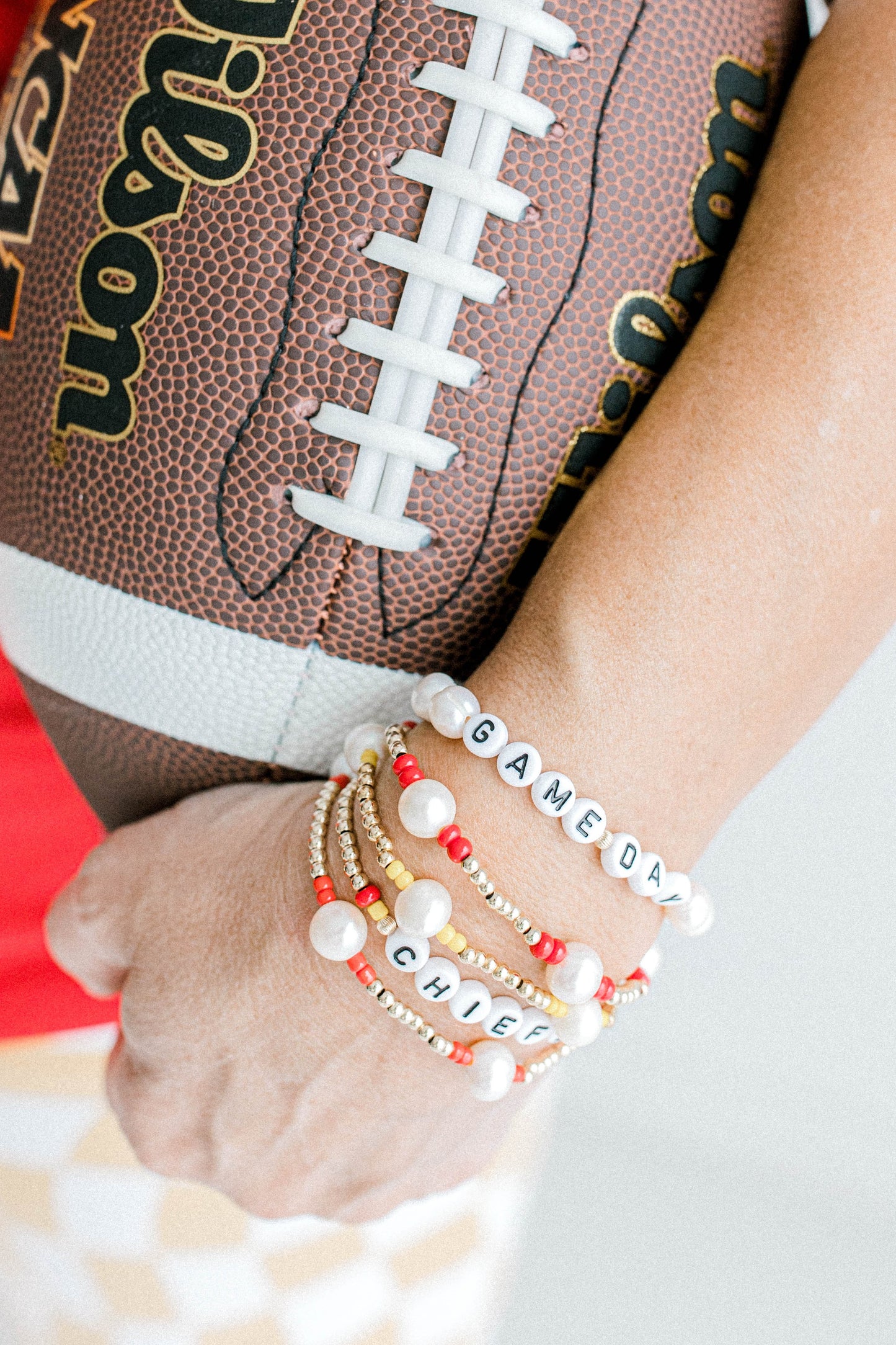 football prop with game day collection bracelets